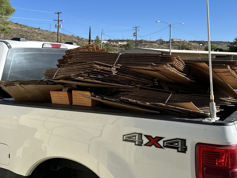 A Trashy Broz work truck loaded on a job in Arizona